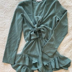 Plunging teal romper with ruffle detail